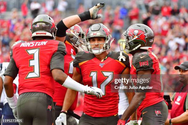 Jameis Winston celebrates with Justin Watson of the Tampa Bay Buccaneers after connecting for a touchdown during the second quarter of a football...