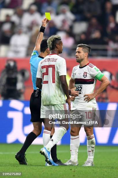 Diego of CR Flamengo is shown a yellow card by referee Abdulrahman Al-Jassim during the FIFA Club World Cup Qatar 2019 Final match between Liverpool...