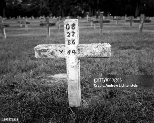 Cross with an X marks the grave for a prisoner executed by the state of Texas in its prison system, as seen in 2009, at the Texas Department of...