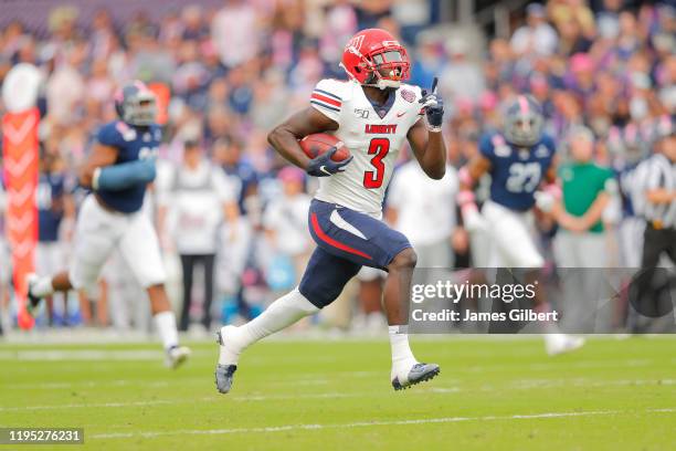 Johnny Huntley of the Liberty Flames scores a touchdown during the first quarter of the 2019 Cure Bowl against the Georgia Southern Eagles at...
