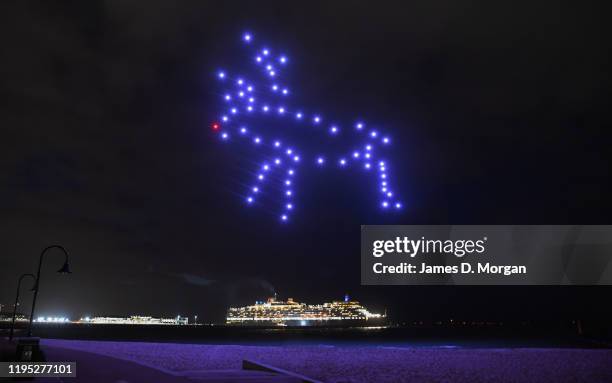 Reindeer made up of illuminated drones with the Cunard ship Queen Elizabeth in the background on December 22, 2019 in Melbourne, Australia. Cunard's...