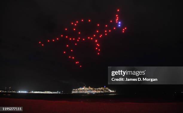 Kangaroo made up of illuminated drones with the Cunard ship Queen Elizabeth in the background on December 22, 2019 in Melbourne, Australia. Cunard's...