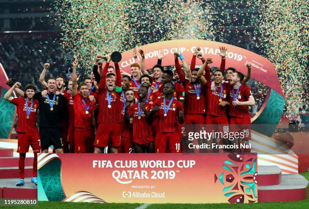 Jordan Henderson of Liverpool lifts the FIFA Club World Cup trophy following his team's victory during the FIFA Club World Cup Qatar 2019 Final...