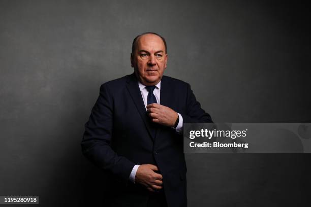 Axel Weber, chairman of UBS Group AG, poses for a photograph following a Bloomberg Television interview on day two of the World Economic Forum in...