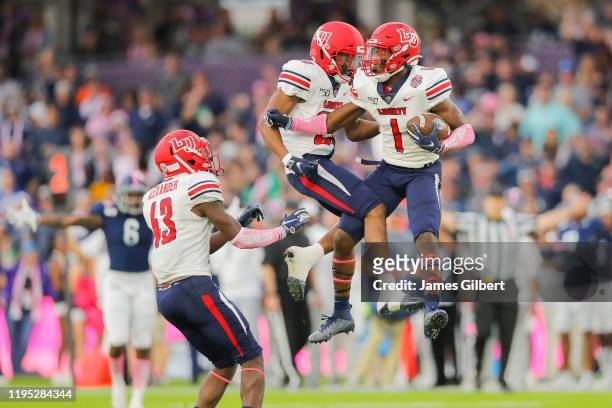Javon Scruggs of the Liberty Flames celebrates after an interception during the second quarter against the Georgia Southern Eagles in the 2019 Cure...