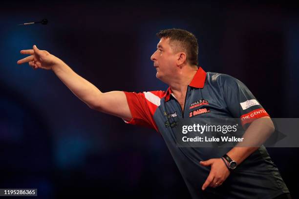 Mensur Suljovic in action during the round 2 match between Mensur Suljovic and Fallon Sherrock on Day 9 of the 2020 William Hill World Darts...
