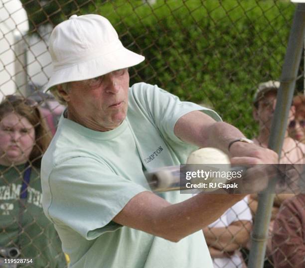 George Plimpton connects with the baseball for a hit