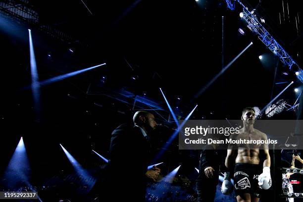 Rico Verhoeven of Netherlands walks off past the fans after retaining his belt against Badr Hari of Morocco during their World Heavyweight Title...