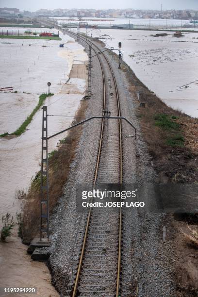 Flooded train tracks are pictured in Malgrat de Mar, near Girona on January 22 as storm Gloria batters Spanish eastern coast. - A winter storm which...