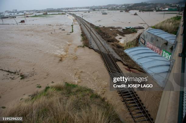 Flooded train tracks are pictured in Malgrat de Mar, near Girona on January 22 as storm Gloria batters Spanish eastern coast. - A winter storm which...