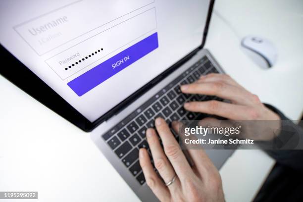 Symbolic picture to the topic of data security. A person logs in to an account with a password on January 08, 2020 in Berlin, Germany.