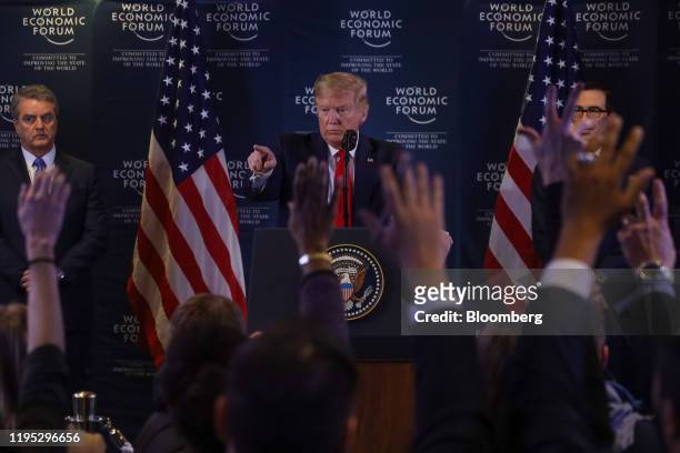 President Donald Trump, center, invites a question from the media during a news conference with Roberto Azevedo, director general of the World Trade...
