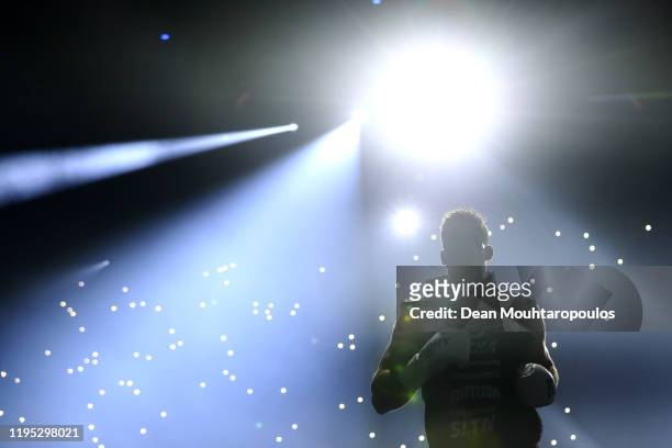 Rico Verhoeven of Netherlands walks out to fight against Badr Hari of Morocco during their World Heavyweight Title kickboxing bout at GLORY 74 Arnhem...