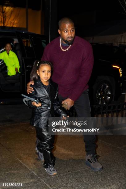 Kanye West and North West are seen in Midtown on December 21, 2019 in New York City.