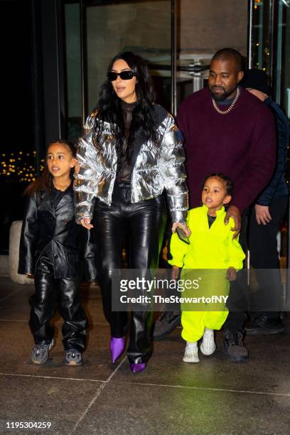 North West, Kim Kardashian, Kanye West and Saint West are seen in Midtown on December 21, 2019 in New York City.