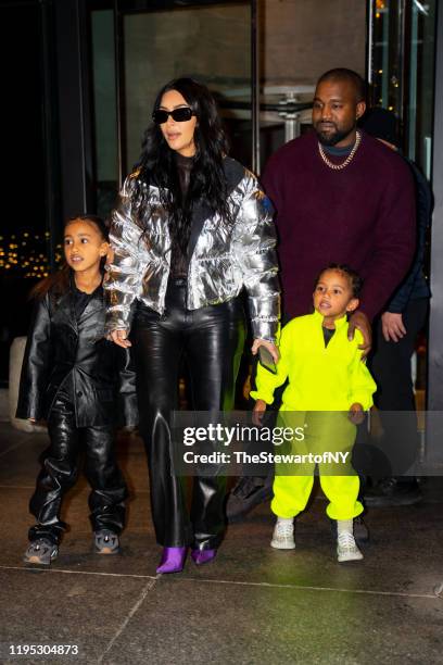 North West, Kim Kardashian, Kanye West and Saint West are seen in Midtown on December 21, 2019 in New York City.