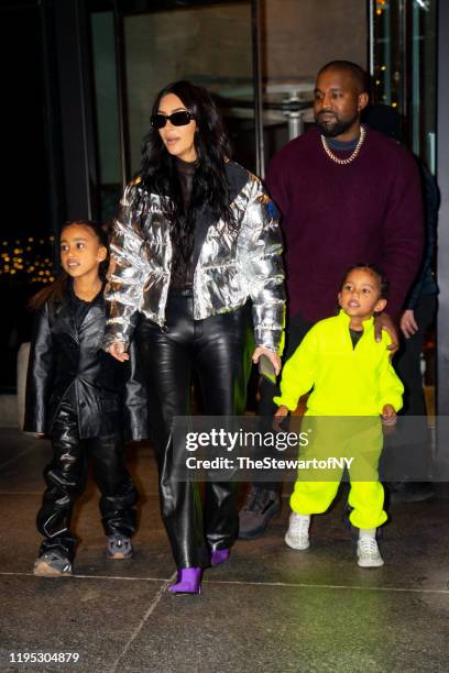 North West, Kim Kardashian, Kanye West and Saint West are seen in Midtown on December 21, 2019 in New York City.