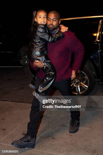 Kanye West and North West are seen in Midtown on December 21, 2019 in New York City.