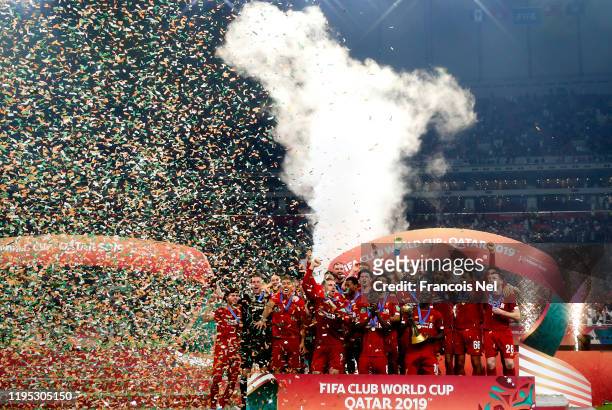 Sadio Mane of Liverpool and teammates celebrate with the FIFA Club World Cup trophy following his team's victory during FIFA Club World Cup Qatar...