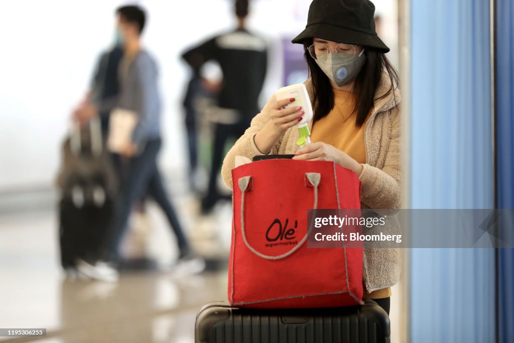 Travelers At Hong Kong Airport And West Kowloon Station As Virus Spreads to Hong Kong