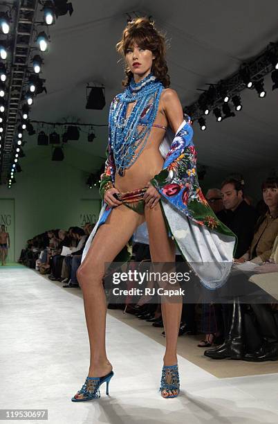 Model wearing Zang Toi Spring 2004 during Mercedes-Benz Fashion Week Spring 2004 - Zang Toi - Runway at Josephine Tent, Bryant Park in New York City,...