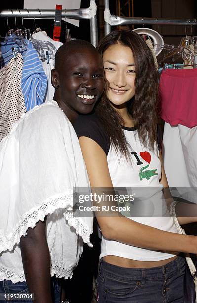 Alek Wek and Ai Tominaga during Mercedes-Benz Fashion Week Spring 2004 - Lacoste - Backstage at Gertrude Tent, Bryant Park in New York City, New...