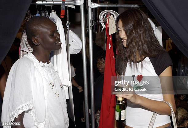Alek Wek and Ai Tominaga during Mercedes-Benz Fashion Week Spring 2004 - Lacoste - Backstage at Gertrude Tent, Bryant Park in New York City, New...
