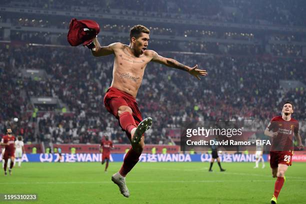 Roberto Firmino of Liverpool celebrates after scoring his team's first goal during the FIFA Club World Cup Qatar 2019 Final match between Liverpool...