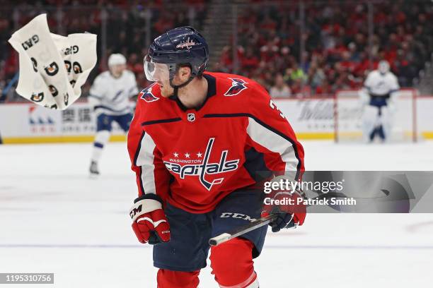 Nick Jensen of the Washington Capitals skates down the ice after having a towel stuck to his skate against the Tampa Bay Lightning during the first...