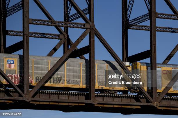 Union Pacific Corp. And Canadian National Railway Co. Freight cars travel across the MacArthur Bridge over the Mississippi River in St. Louis,...