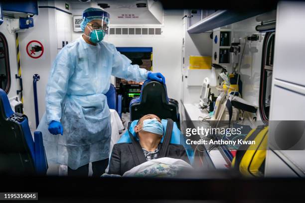Patient is transferred by an ambulance to the Infectious Disease Centre of Princess Margaret Hospital on January 22, 2020 in Hong Kong, China. Hong...