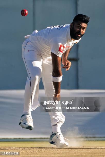 Sri Lanka's bowler Lahiru Kumara eyes the ball during the fourth day of the first Test cricket match played between Zimbabwe and Sri Lanka at the...