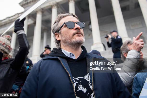 Joaquin Phoenix is seen on the center steps of the Capitol before being arrested during a weekly rally with Jane Fonda to call for action on climate...