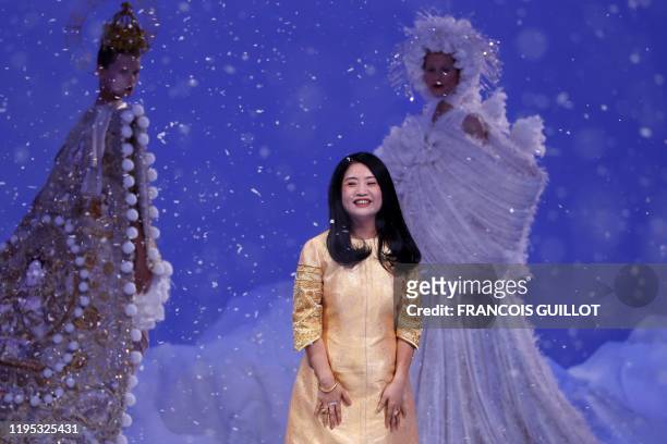 Chinese fashion designer Guo Pei acknowledges the audience at the end of the Women's Spring-Summer 2020 Haute Couture collection fashion show in...