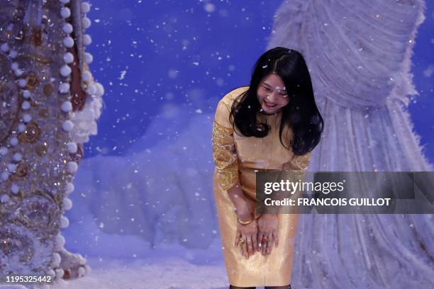 Chinese fashion designer Guo Pei acknowledges the audience at the end of the Women's Spring-Summer 2020 Haute Couture collection fashion show in...