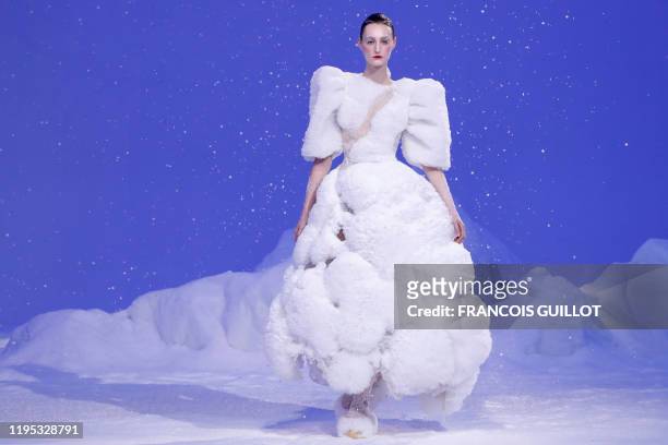 Model presents a creation by Guo Pei during the Women's Spring-Summer 2020 Haute Couture collection fashion show in Paris, on January 22, 2020.
