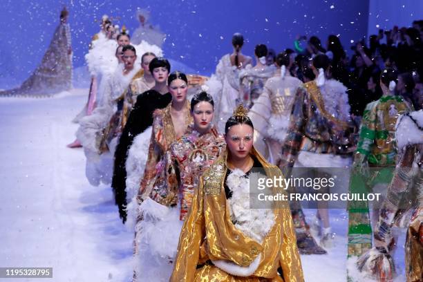 Models present creations by Guo Pei during the Women's Spring-Summer 2020 Haute Couture collection fashion show in Paris, on January 22, 2020.