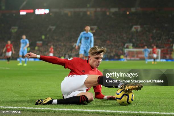 Brandon Williams of Man Utd controls the ball at the byline during the Premier League match between Manchester United and Burnley FC at Old Trafford...