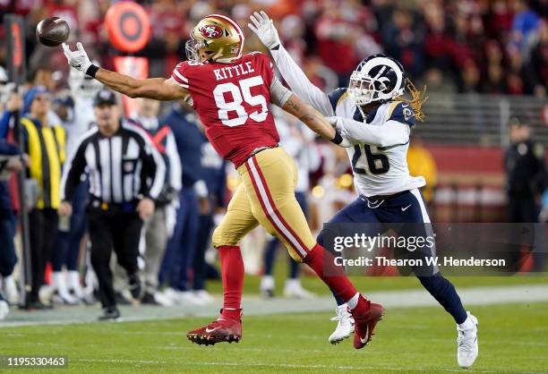 Tight end George Kittle of the San Francisco 49ers makes a play for the ball over defensive back Marqui Christian of the Los Angeles Rams at Levi's...