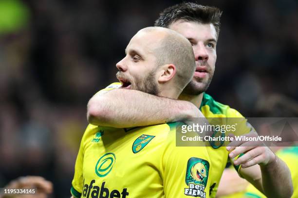 Teemu Pukki of Norwich celebrates scoring their 1st goal from the penalty spot with captain Grant Hanley during the Premier League match between...