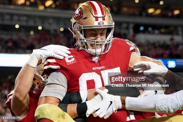 Tight end George Kittle of the San Francisco 49ers and teammates celebrate his fourth quarter touchdown over the Los Angeles Rams at Levi's Stadium...