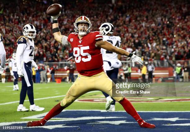 Tight end George Kittle of the San Francisco 49ers spikes the ball after his fourth quarter touchdown over the Los Angeles Rams at Levi's Stadium on...