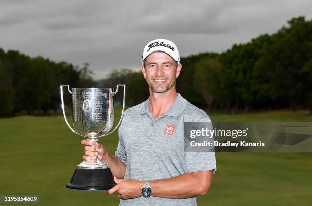 Adam Scott of Australia celebrates victory as he holds up the Kirkwood Cup during day four of the PGA Championships at RACV Royal Pines on December...