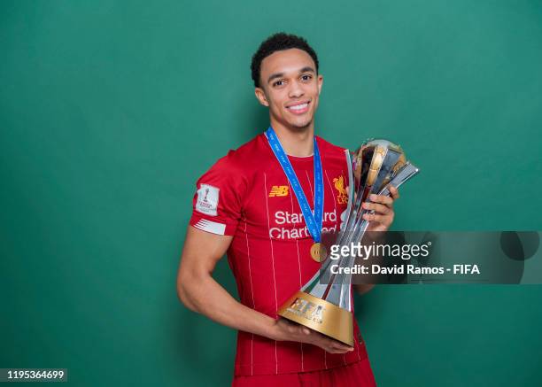 Trent Alexander-Arnold of Liverpool poses with the Club World Cup trophy after the FIFA Club World Cup Qatar 2019 Final match between Liverpool and...