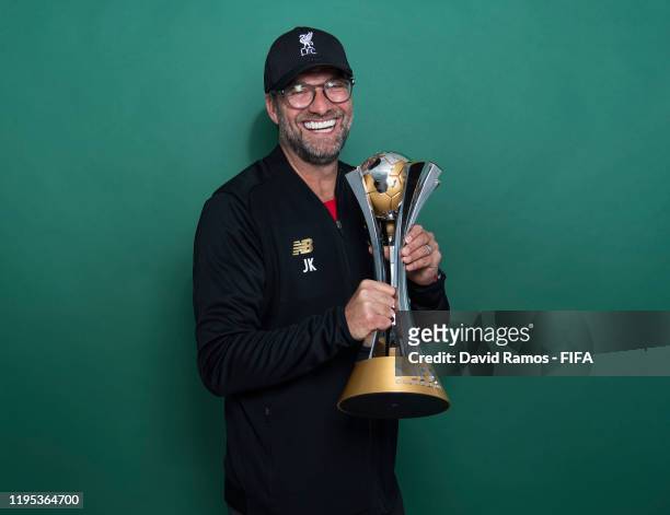 Manager Jurgen Klopp of Liverpool poses with the Club World Cup trophy after the FIFA Club World Cup Qatar 2019 Final match between Liverpool and CR...