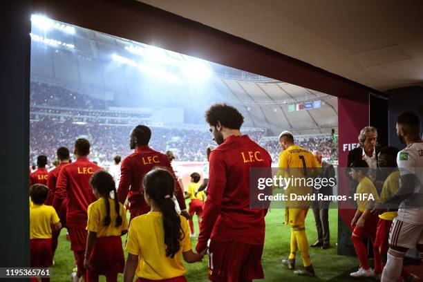 Players of Liverpool and CR Flamengo walk out to the pitch ahead of the FIFA Club World Cup Qatar 2019 Final match between Liverpool FC and CR...