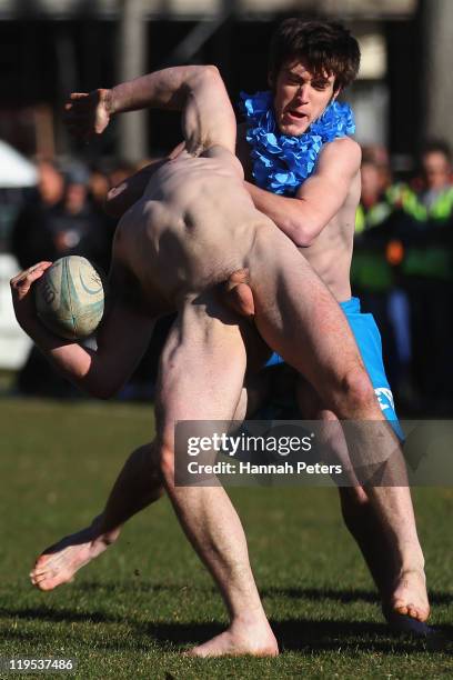 Member of the Nude Blacks is tackled during the nude rugby match between the Nude Blacks and a Fijian Invitational side at Logan Park on July 22,...