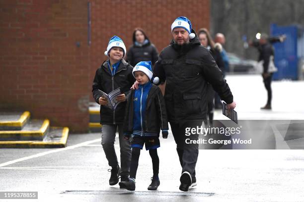 Fans arrive at the stadium ahead of the Sky Bet Championship match between Sheffield Wednesday and Bristol City at Hillsborough Stadium on December...