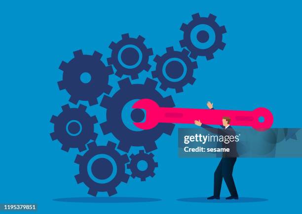 businessman holding wrench to repair running gear - repairing stock illustrations
