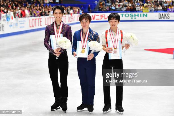 Yuzuru Hanyu , Shoma Uno and Yuma Kagiyama pose with their medals during day four of the 88th All Japan Figure Skating Championships at the Yoyogi...